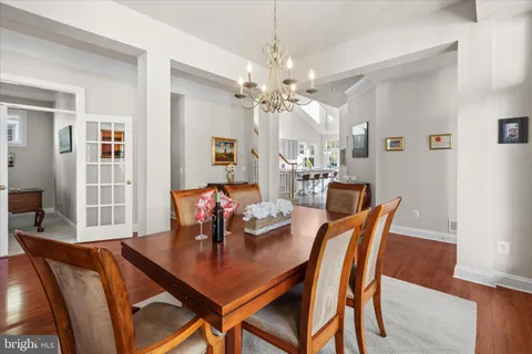 a kitchen with stainless steel appliances granite countertop a refrigerator sink and stove