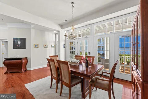 a living room with kitchen island furniture and a kitchen view