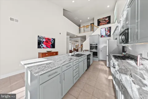 a living room with furniture fireplace and a flat screen tv