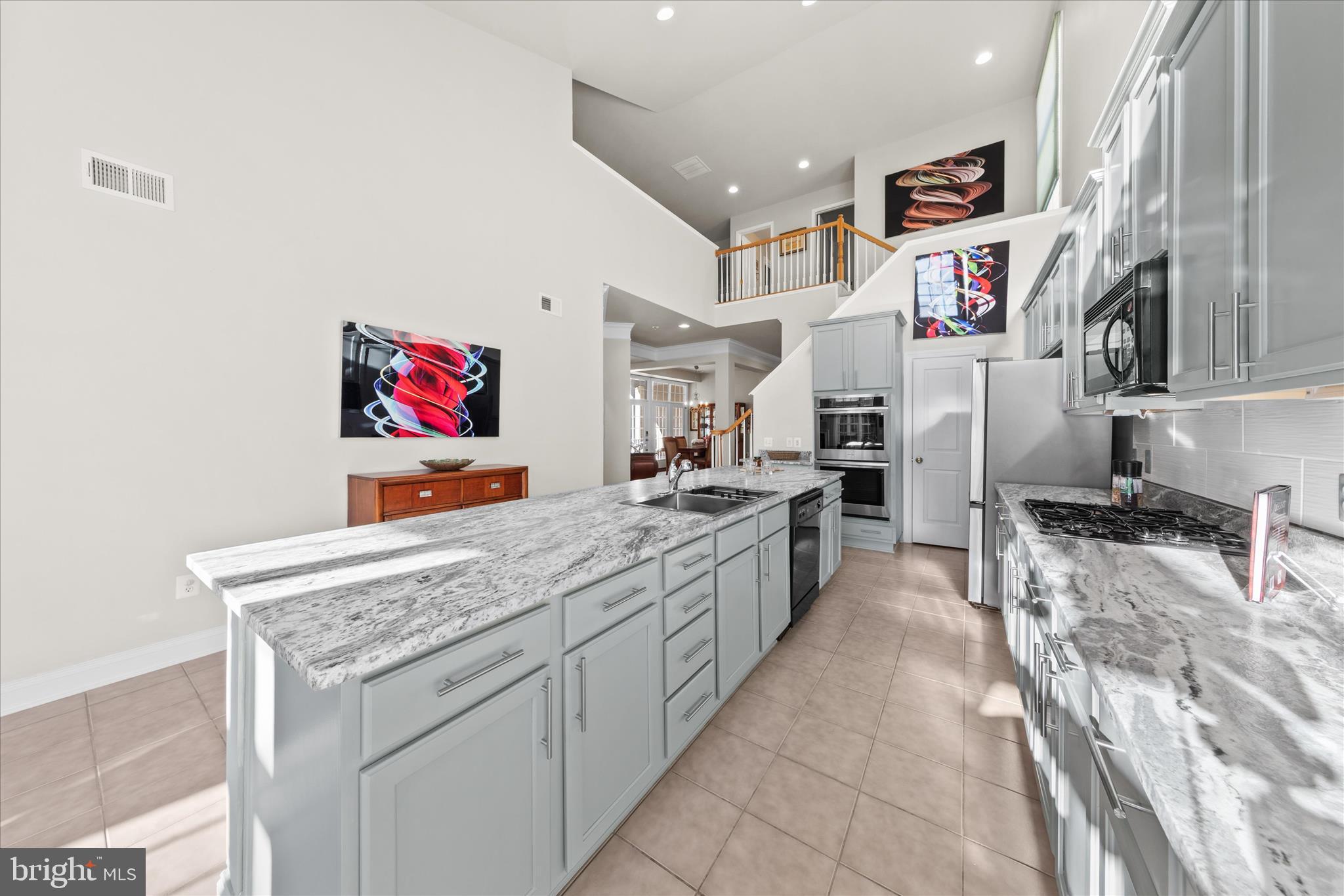 33067 Secluded Path, Unit 125 Millsboro, DE 19966 - Photo 16 of 64 a kitchen with stainless steel appliances granite countertop a stove and cabinets