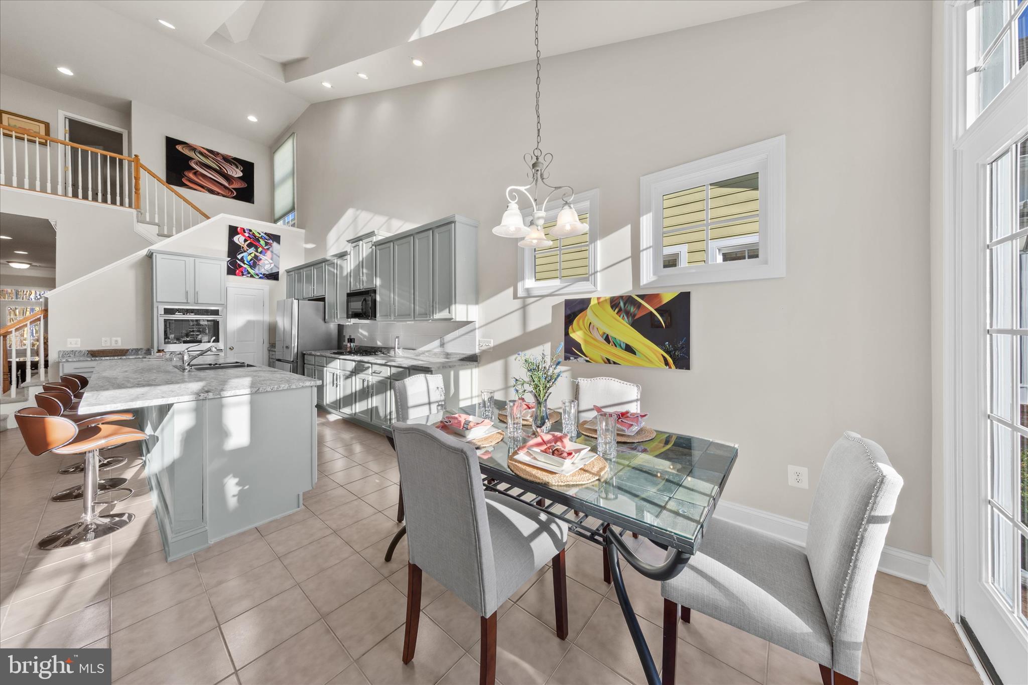 33067 Secluded Path, Unit 125 Millsboro, DE 19966 - Photo 21 of 64 a dining room filled chandelier and kitchen view