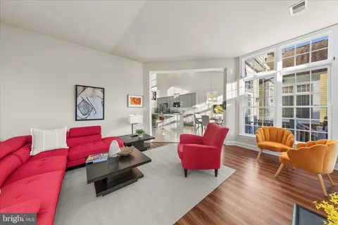 a bathroom with a tub sink double vanity mirror and