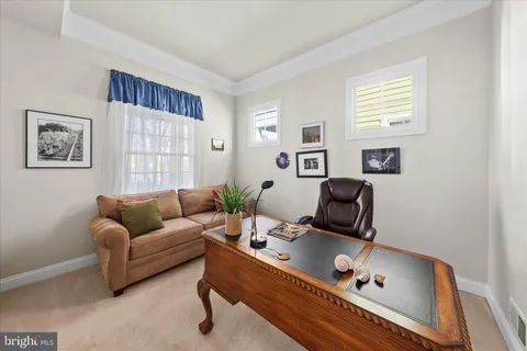 a living room with furniture fireplace and a flat screen tv