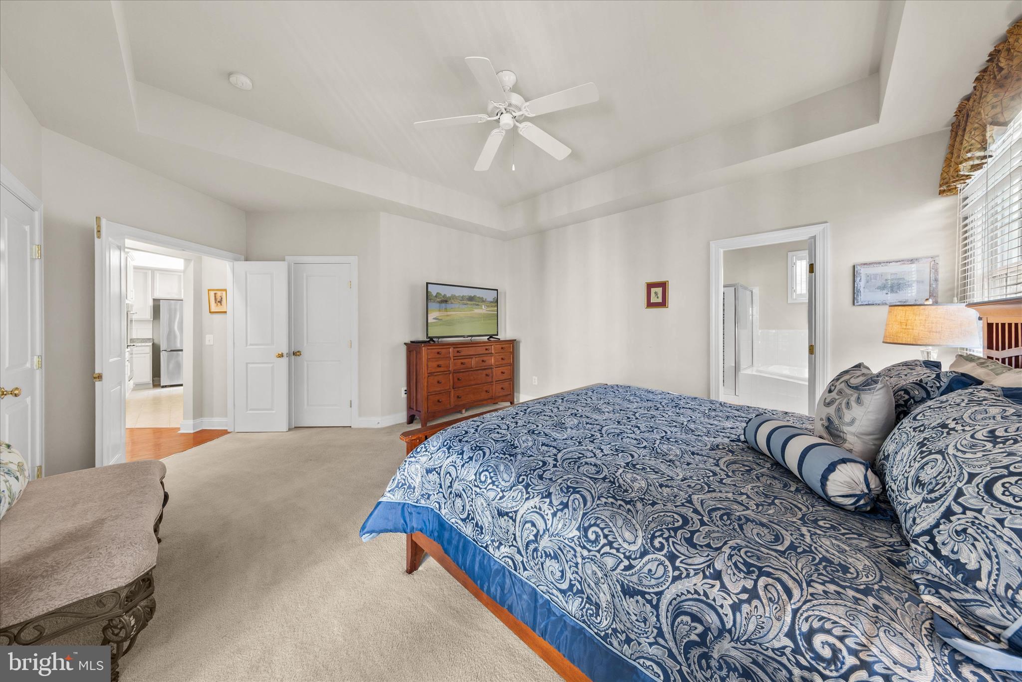 33067 Secluded Path, Unit 125 Millsboro, DE 19966 - Photo 34 of 64 a bedroom with a large bed and a dresser