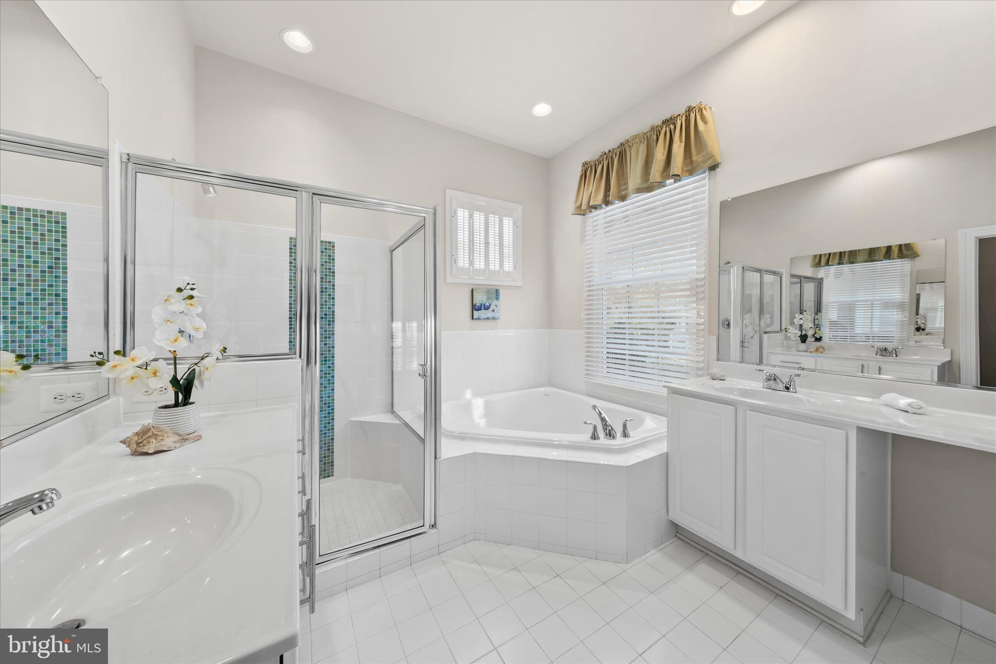 33067 Secluded Path, Unit 125 Millsboro, DE 19966 - Photo 38 of 64 a bathroom with a tub sink double vanity mirror and