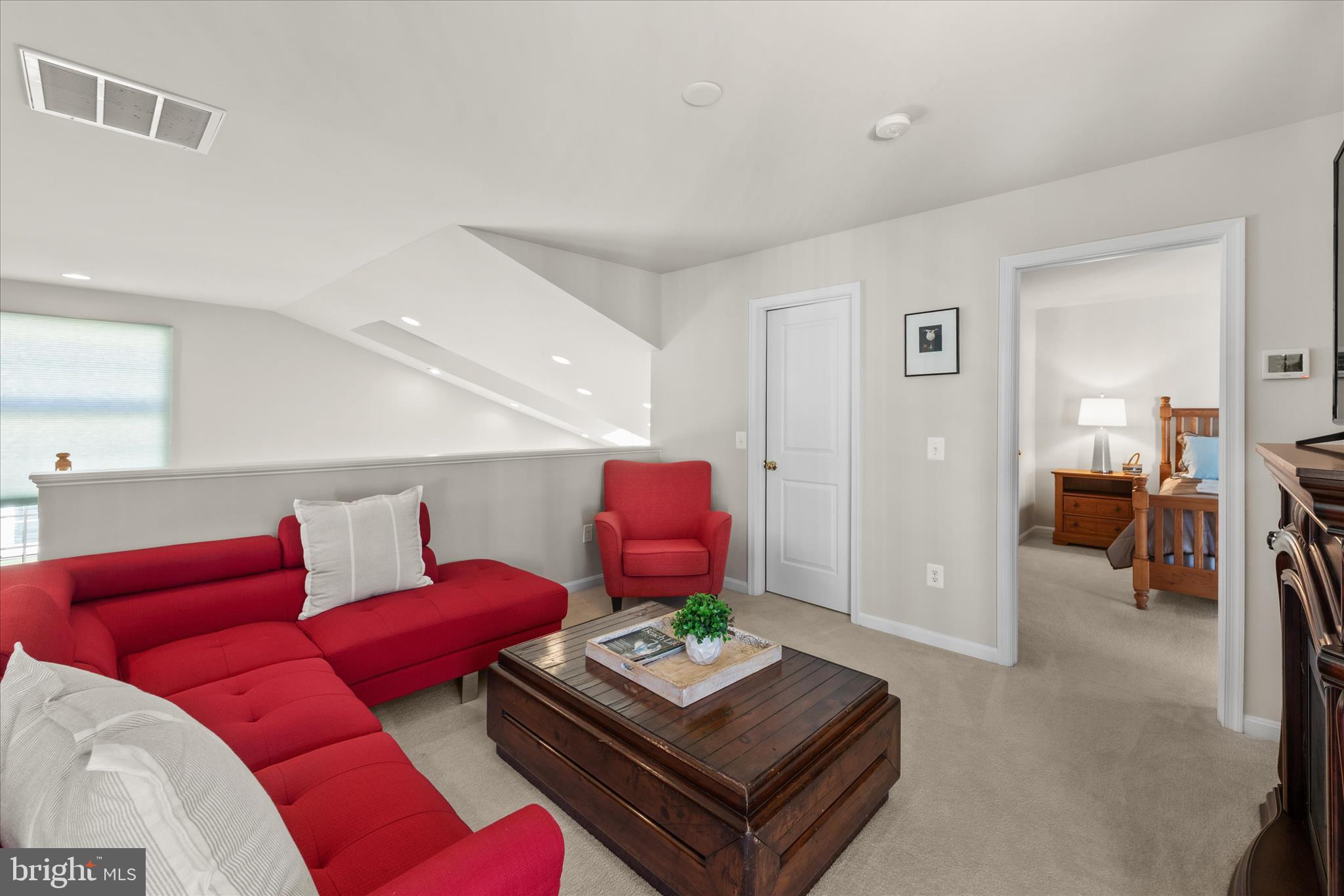 33067 Secluded Path, Unit 125 Millsboro, DE 19966 - Photo 39 of 64 a living room with furniture and a table