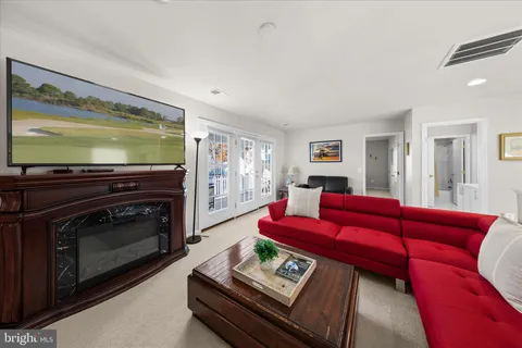 a bedroom with furniture and a wooden floor
