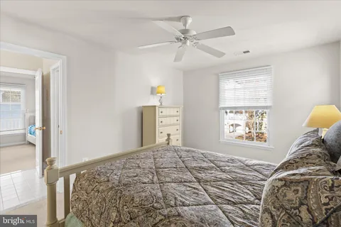 a bathroom with a sink vanity mirror and toilet
