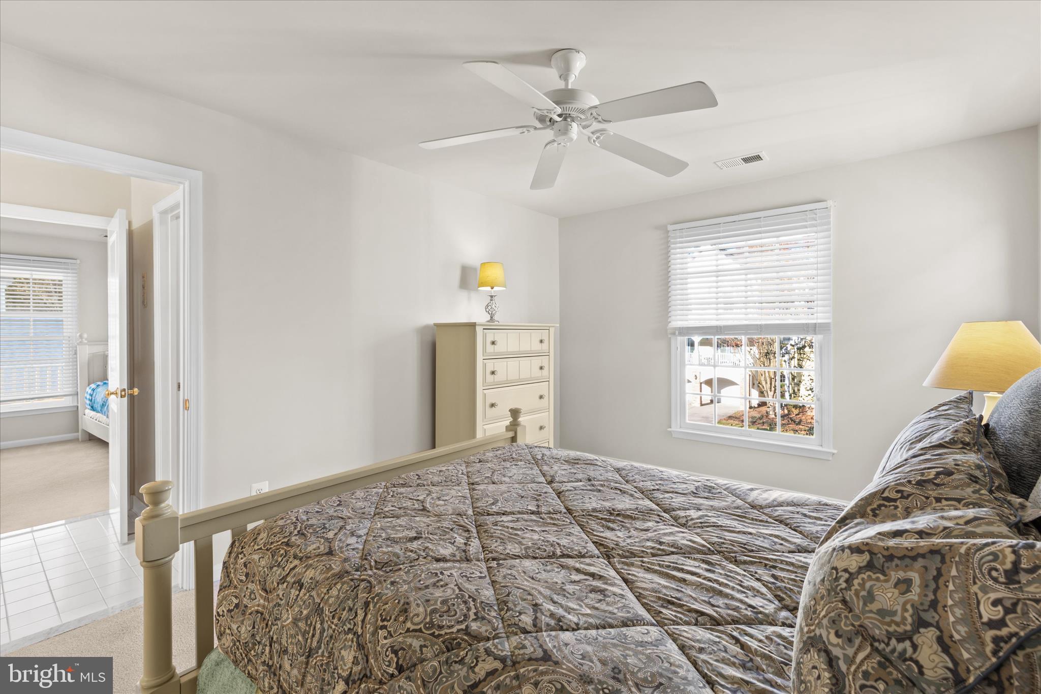 33067 Secluded Path, Unit 125 Millsboro, DE 19966 - Photo 44 of 64 a bedroom with a bed and a window