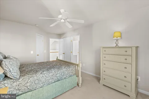 a view of a balcony with chair and wooden floor