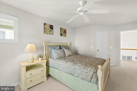 a balcony with chairs and table in wooden floor
