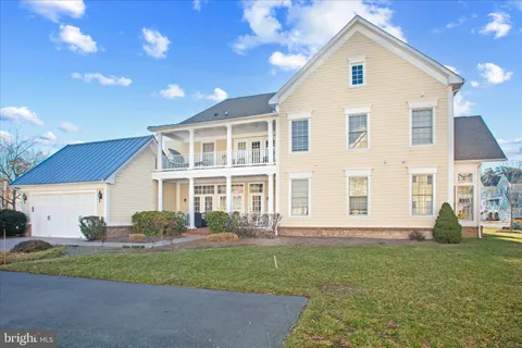 a balcony with chairs and wooden floor