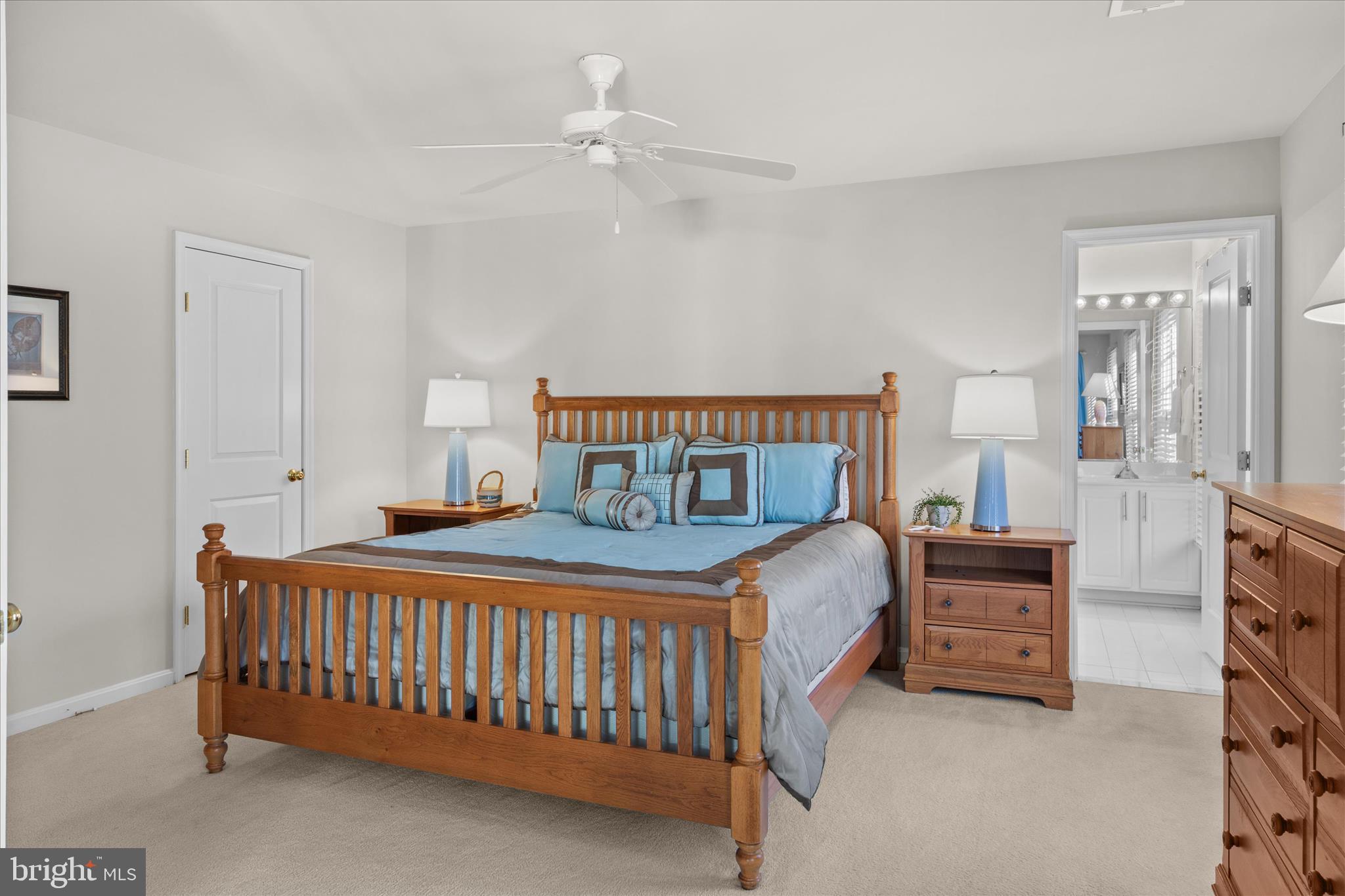 33067 Secluded Path, Unit 125 Millsboro, DE 19966 - Photo 54 of 64 a bedroom with a bed and a chandelier