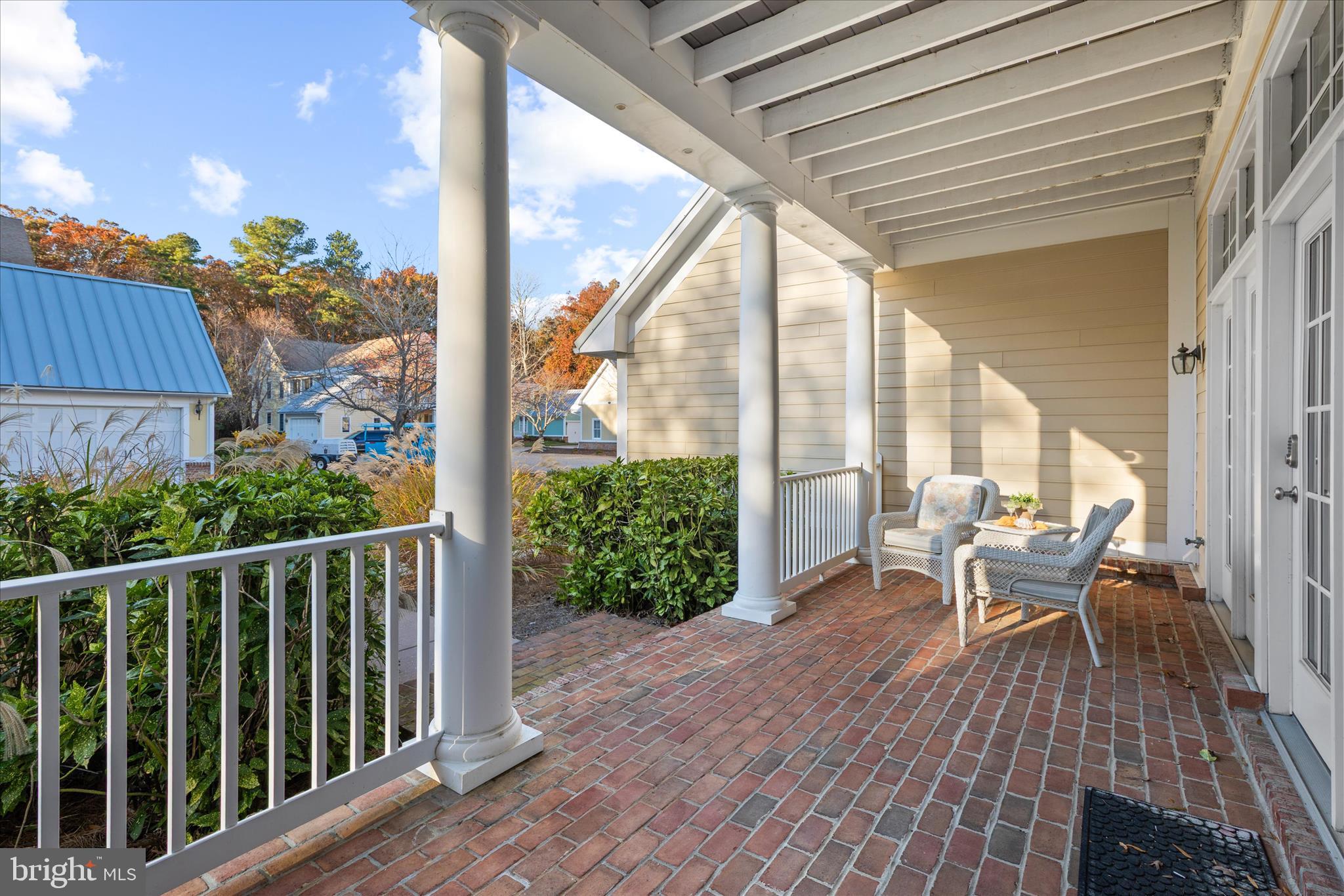 33067 Secluded Path, Unit 125 Millsboro, DE 19966 - Photo 63 of 64 a view of a balcony with chairs and wooden floor