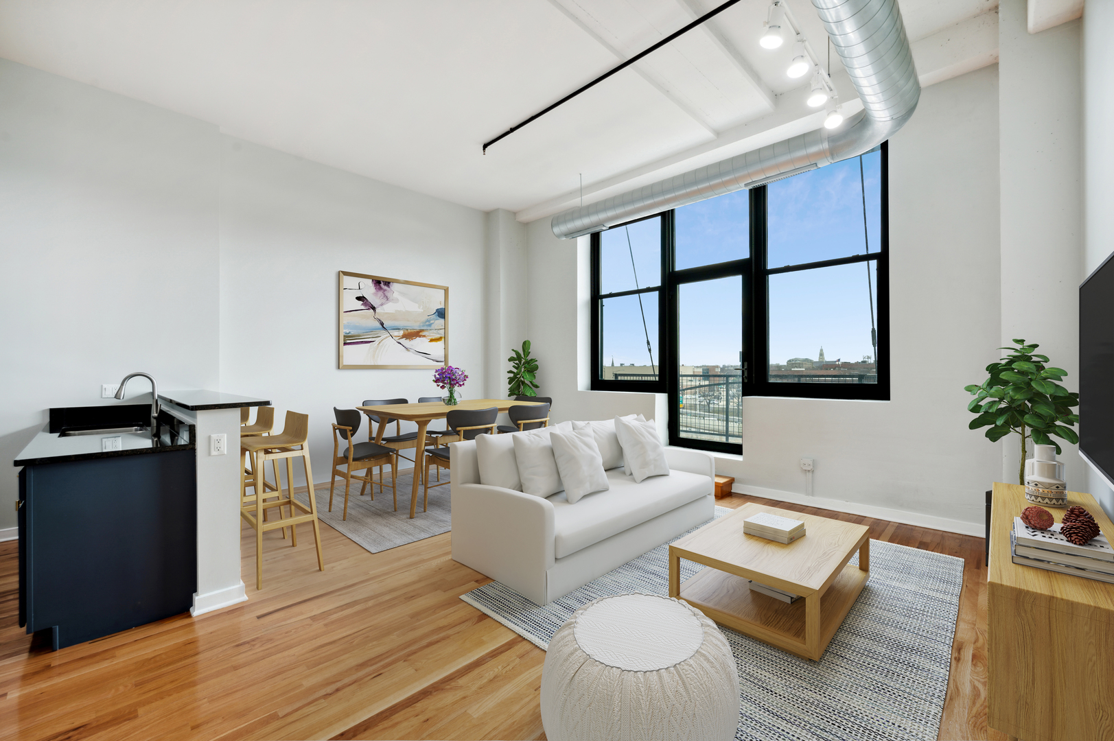 1224 West Van Buren Street, Unit 300 Chicago, IL 60607 - Photo 4 of 18 a living room with furniture a large window and wooden floor