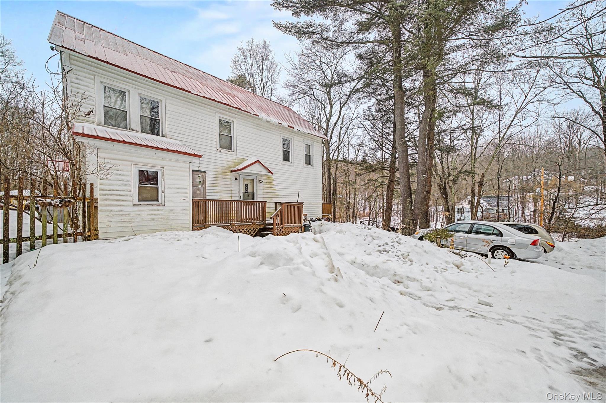 2 Station Hill Road, Unit 4 Ferndale, NY 12734 - Photo 2 of 25 Snow covered rear of property with a wooden deck