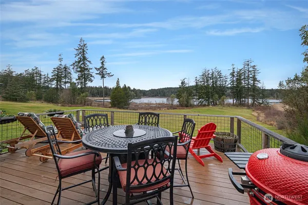 an outdoor seating with furniture and city view