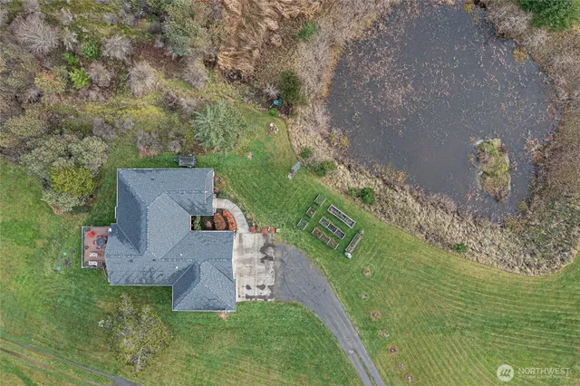 an aerial view of a house with outdoor space