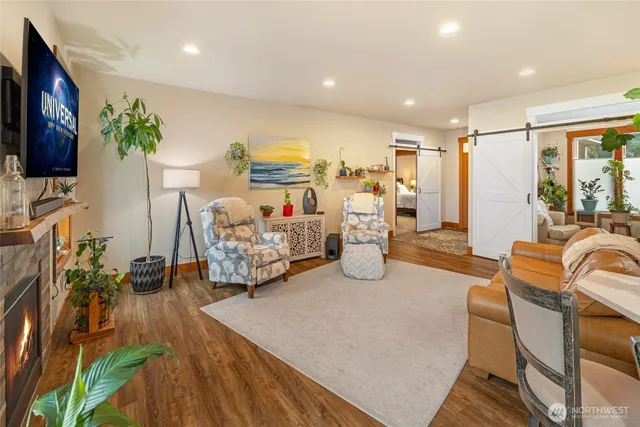 a room with furniture and a flat screen tv