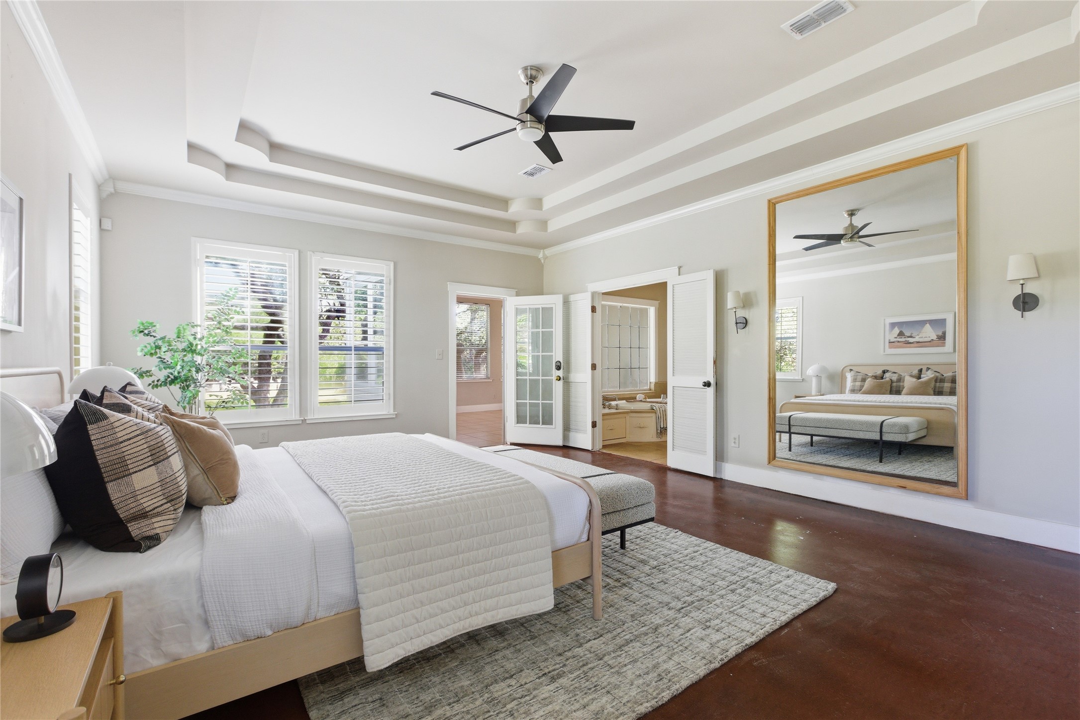 9008 Zyle Road Austin, TX 78737 - Photo 3 of 40 Large primary bedroom suite features trey ceilings, wood floors and great natural light.