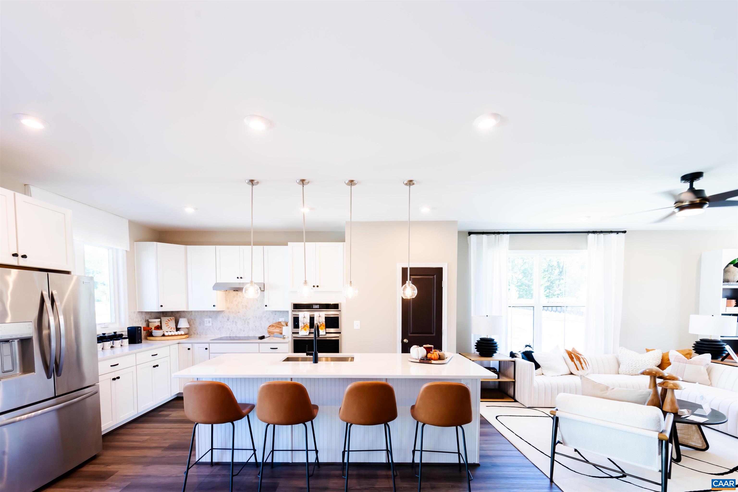 3060 Horizon Road Charlottesville, VA 22902 - Photo 12 of 27 a kitchen with sink a refrigerator and chairs