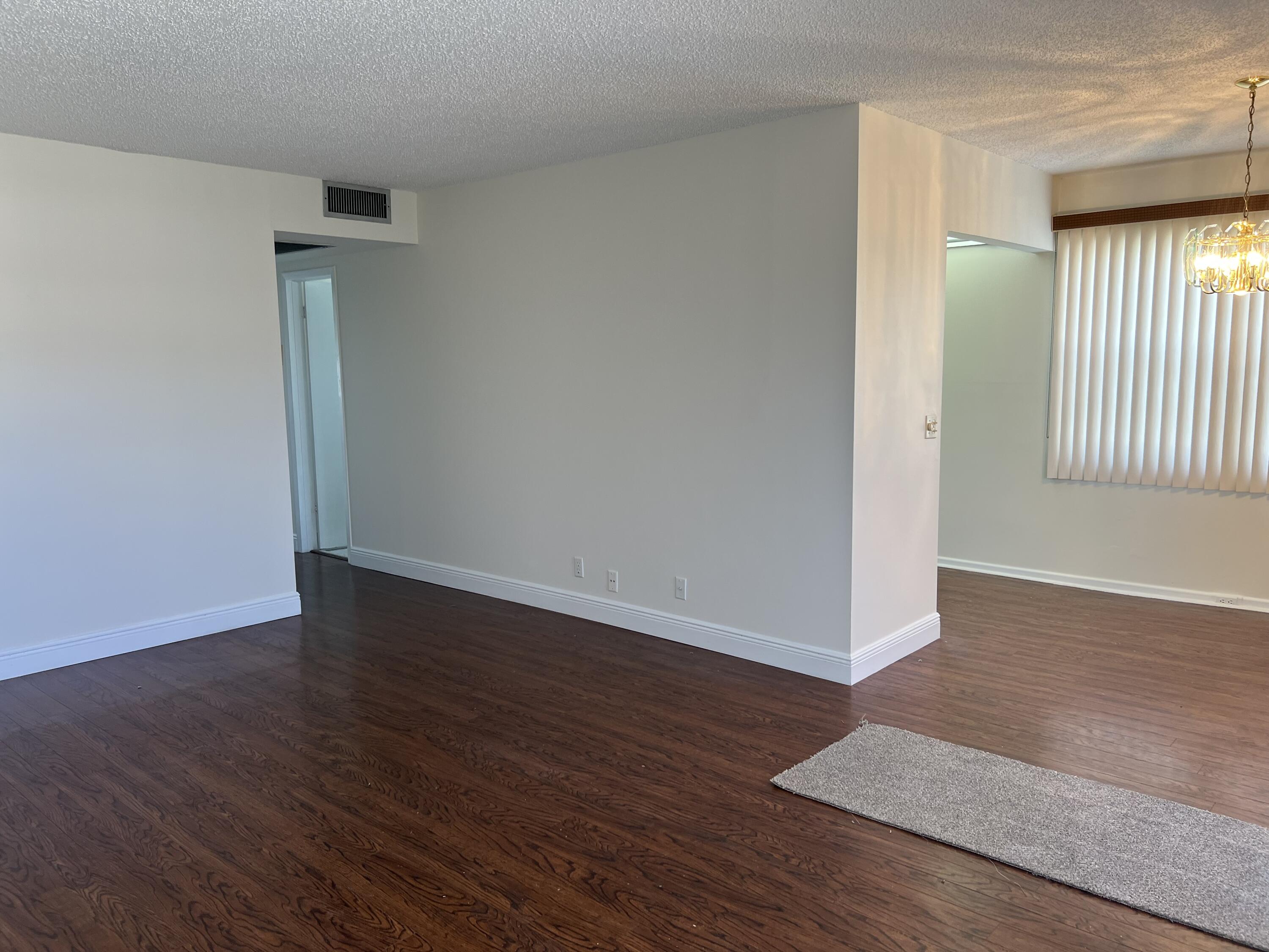 116 Brighton C, Unit 116 Boca Raton, FL 33434 - Photo 3 of 16 LIVING ROOM TO DINING ROOM