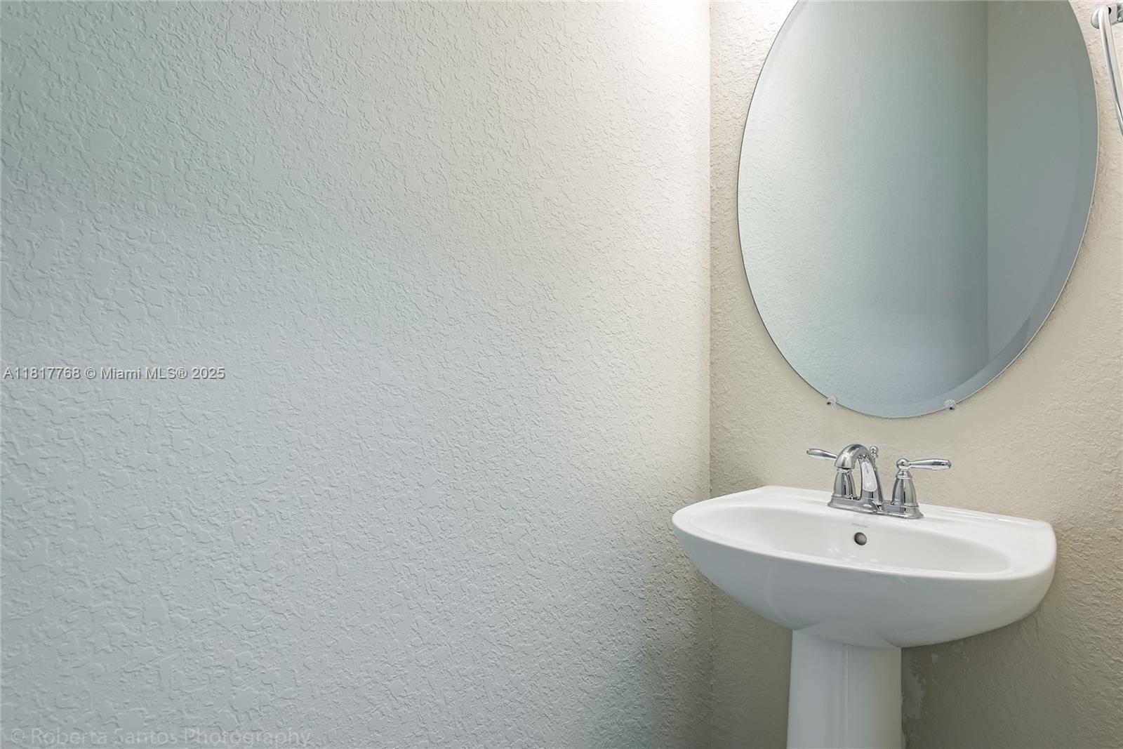 1040 Eucalyptus Drive, Unit 6 Hollywood, FL 33021 - Photo 17 of 41 a sink with a mirror