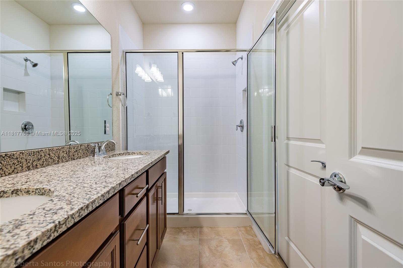 1040 Eucalyptus Drive, Unit 6 Hollywood, FL 33021 - Photo 18 of 41 a bathroom with a granite countertop sink and a mirror