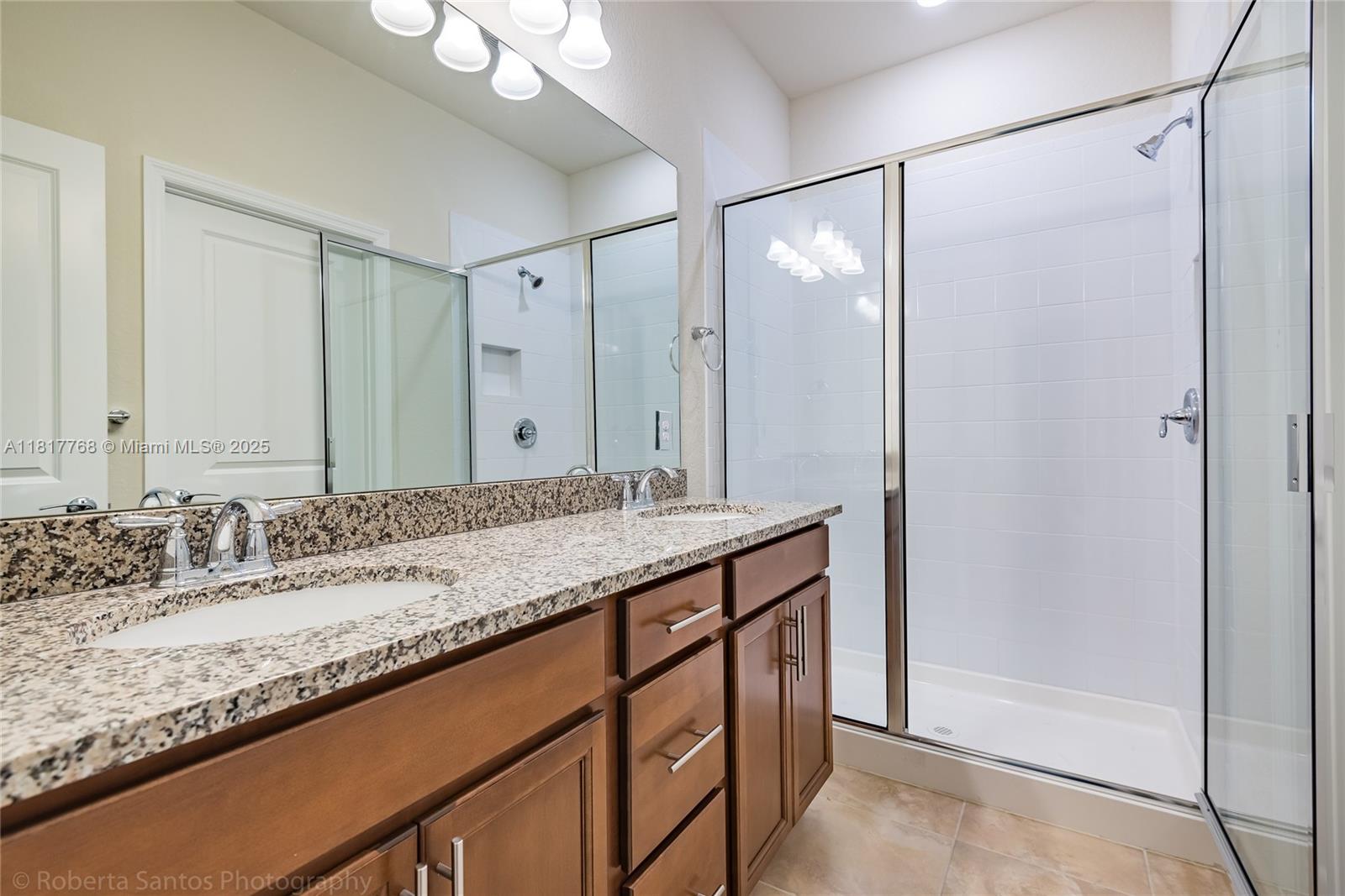 1040 Eucalyptus Drive, Unit 6 Hollywood, FL 33021 - Photo 19 of 41 a bathroom with a granite countertop sink and a mirror