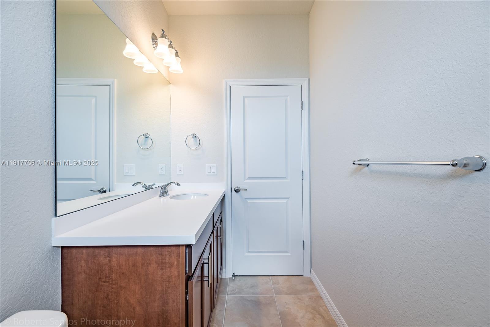 1040 Eucalyptus Drive, Unit 6 Hollywood, FL 33021 - Photo 28 of 41 a bathroom with a sink a mirror and a shower