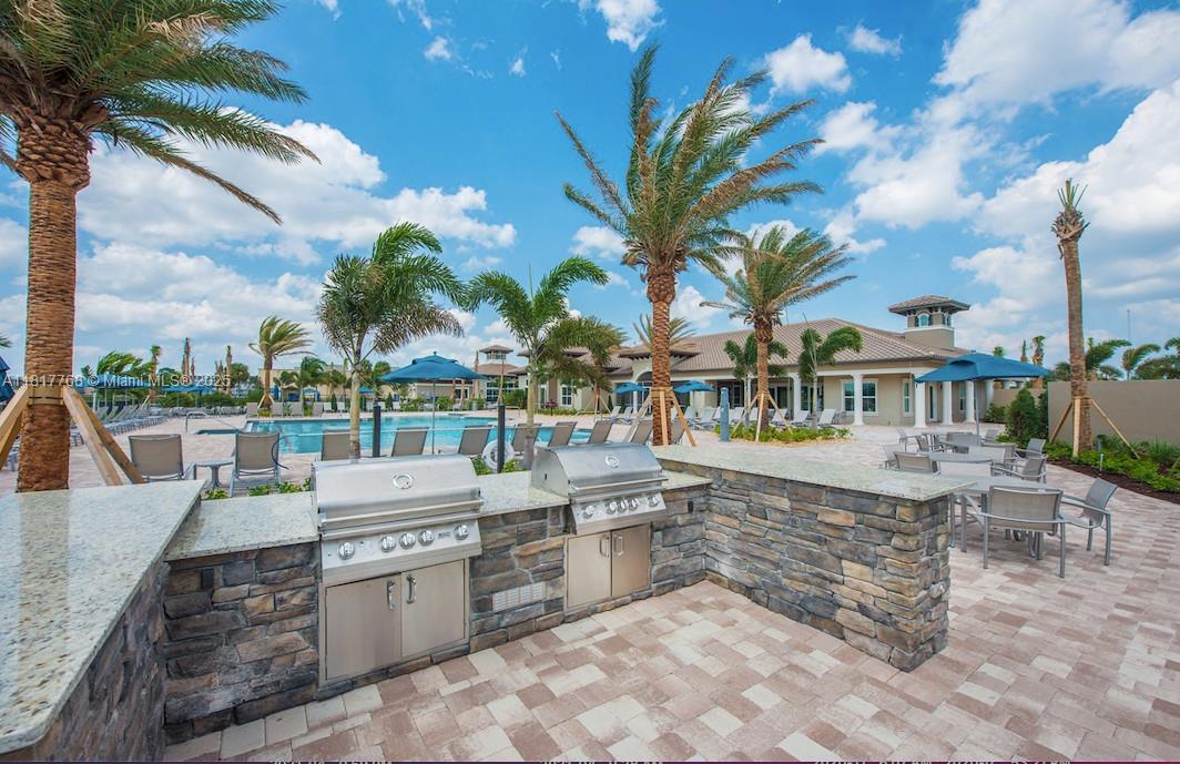 1040 Eucalyptus Drive, Unit 6 Hollywood, FL 33021 - Photo 36 of 41 a large outdoor space with patio