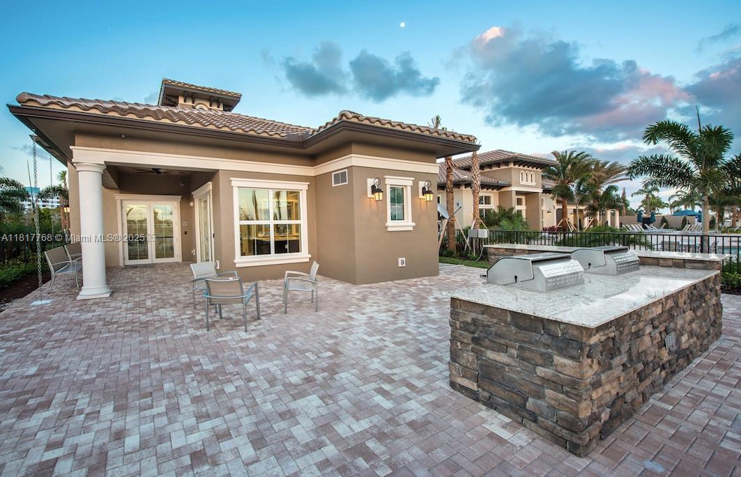 1040 Eucalyptus Drive, Unit 6 Hollywood, FL 33021 - Photo 37 of 41 a view of a house with a yard and porch