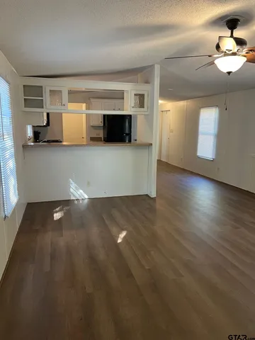 a view of living room with furniture and flat screen tv