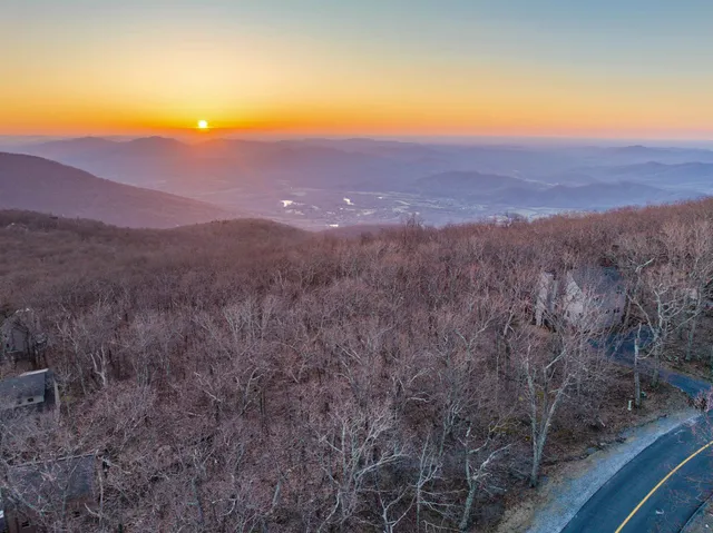 a view of a large mountains in a field