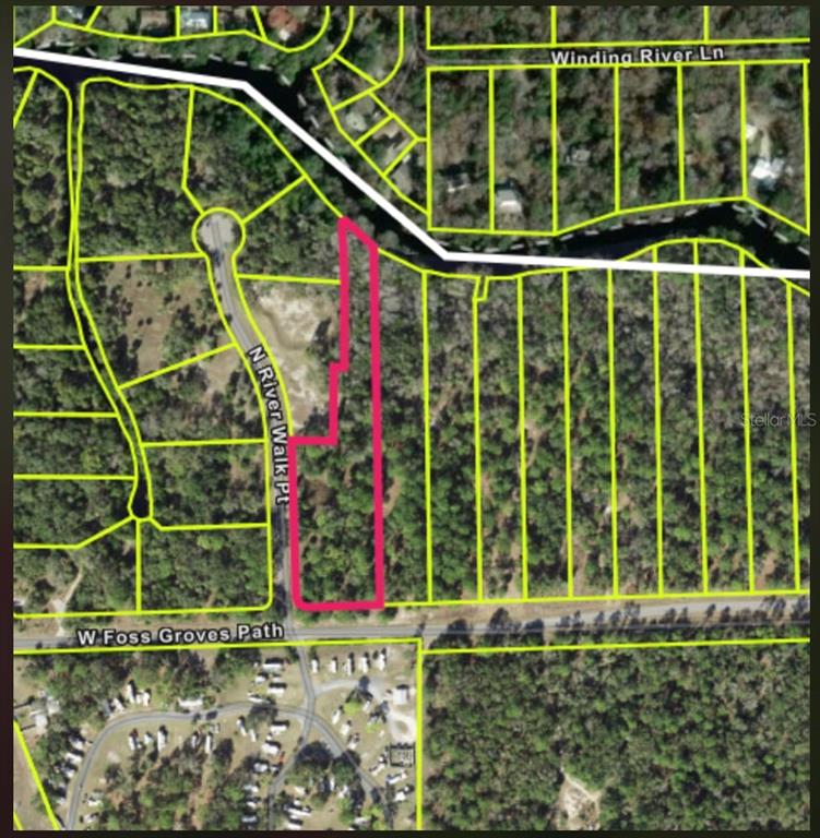 13789 West Foss Grove Path Inglis, FL 34449 - Photo 3 of 8 a house view with a garden space