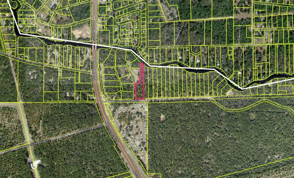 13789 West Foss Grove Path Inglis, FL 34449 - Photo 6 of 8 a view of a glass building