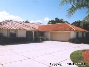 30 Spoonbill Road Manalapan, FL 33462 - Photo 1 of 1 a front view of a house with a yard