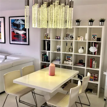 a kitchen with a table and chairs in it