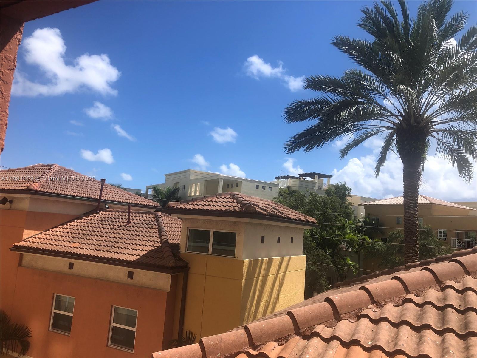 90 Alton Road, Unit 307 Miami Beach, FL 33139 - Photo 8 of 11 a front view of a house with a yard