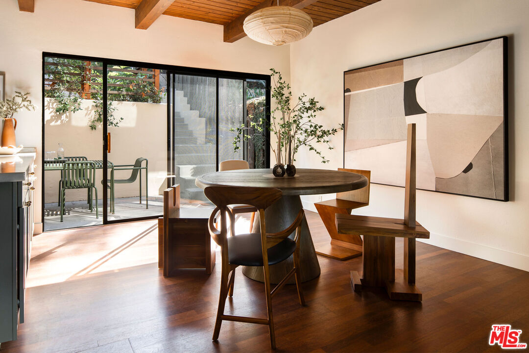 2996 Hyperion Avenue Los Angeles, CA 90027 - Photo 12 of 40 a view of a dining room with furniture window and wooden floor