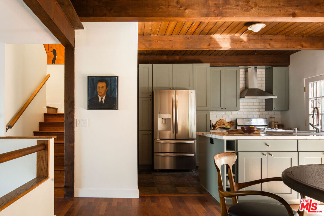 2996 Hyperion Avenue Los Angeles, CA 90027 - Photo 13 of 40 a kitchen with a refrigerator a stove and a wooden floor