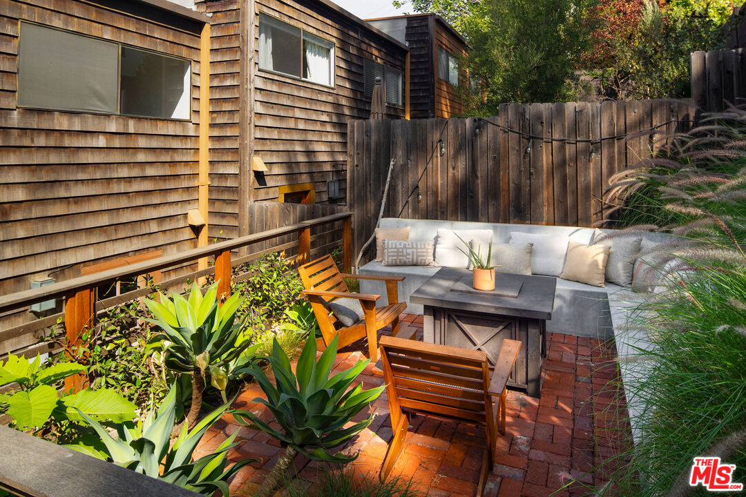 2996 Hyperion Avenue Los Angeles, CA 90027 - Photo 40 of 40 a view of a backyard with chairs and potted plants