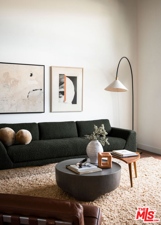 2996 Hyperion Avenue Los Angeles, CA 90027 - Photo 6 of 40 a living room with furniture and wall painting