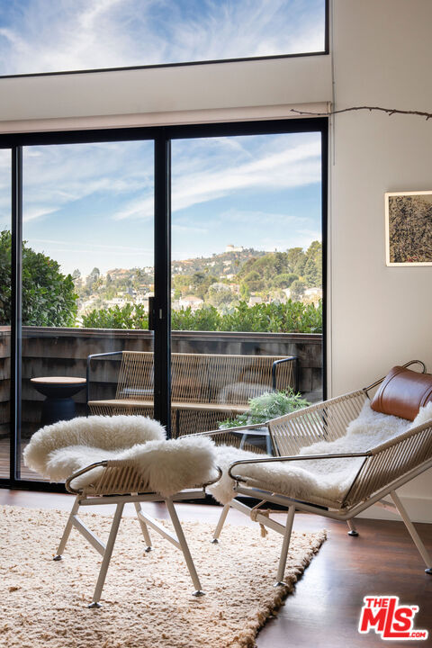2996 Hyperion Avenue Los Angeles, CA 90027 - Photo 9 of 40 a living room with patio furniture and a floor to ceiling window