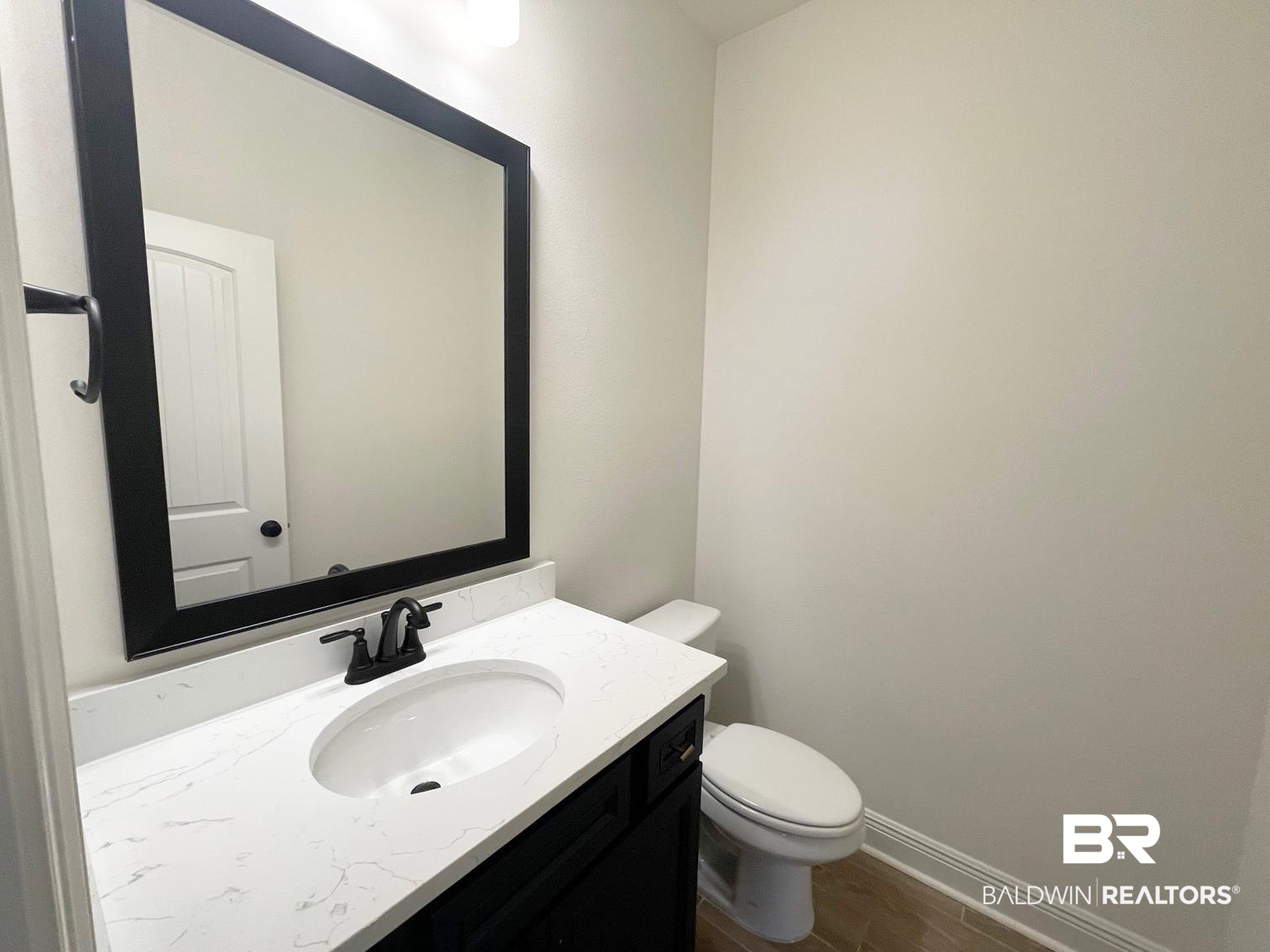 1363 Fenton Circle Foley, AL 36535 - Photo 17 of 20 Bathroom featuring hardwood / wood-style floors, vanity, and toilet