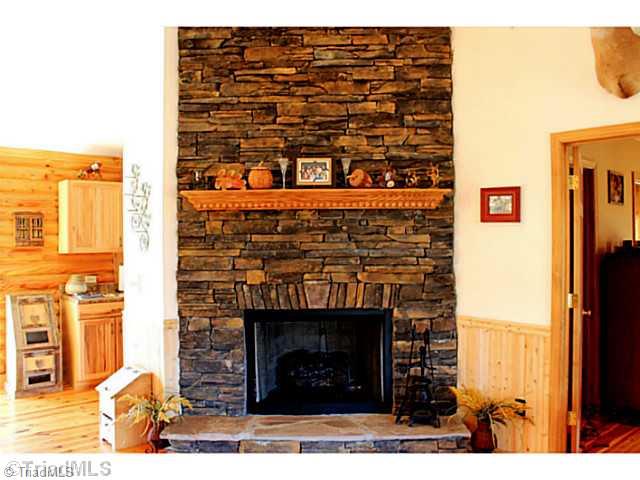 446 Nance Road Denton, NC 27239 - Photo 3 of 14 Living Room. Stone floor to ceiling gas log fireplace