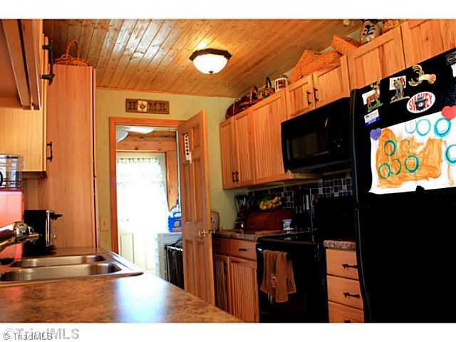 446 Nance Road Denton, NC 27239 - Photo 5 of 14 Kitchen. Custom cabinets with tile backsplash