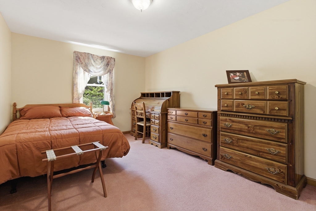 19 Mockingbird Lane Maynard, MA 01754 - Photo 15 of 34 a bedroom with a bed and dresser