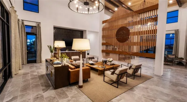 a dining room with furniture and a mirror