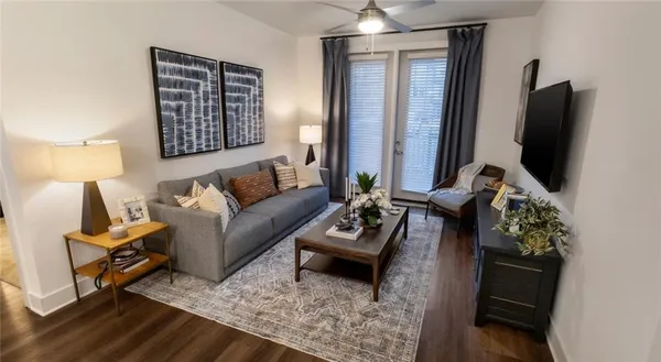 a living room with furniture and a flat screen tv